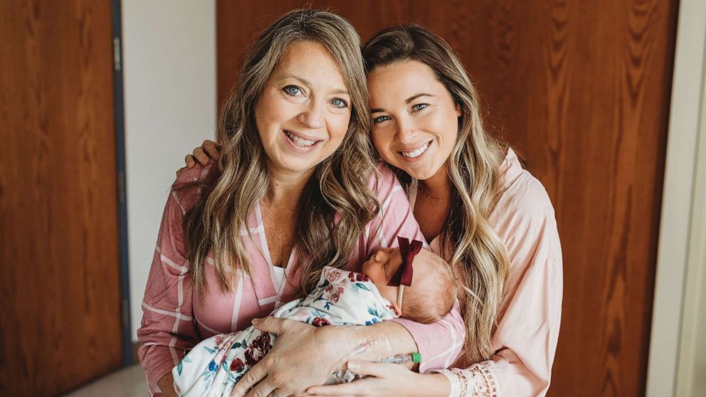 PHOTO: Julie Loving, left, holds her granddaughter Briar Juliette Lockwood as she poses alongside her daughter, Breanna Lockwood.