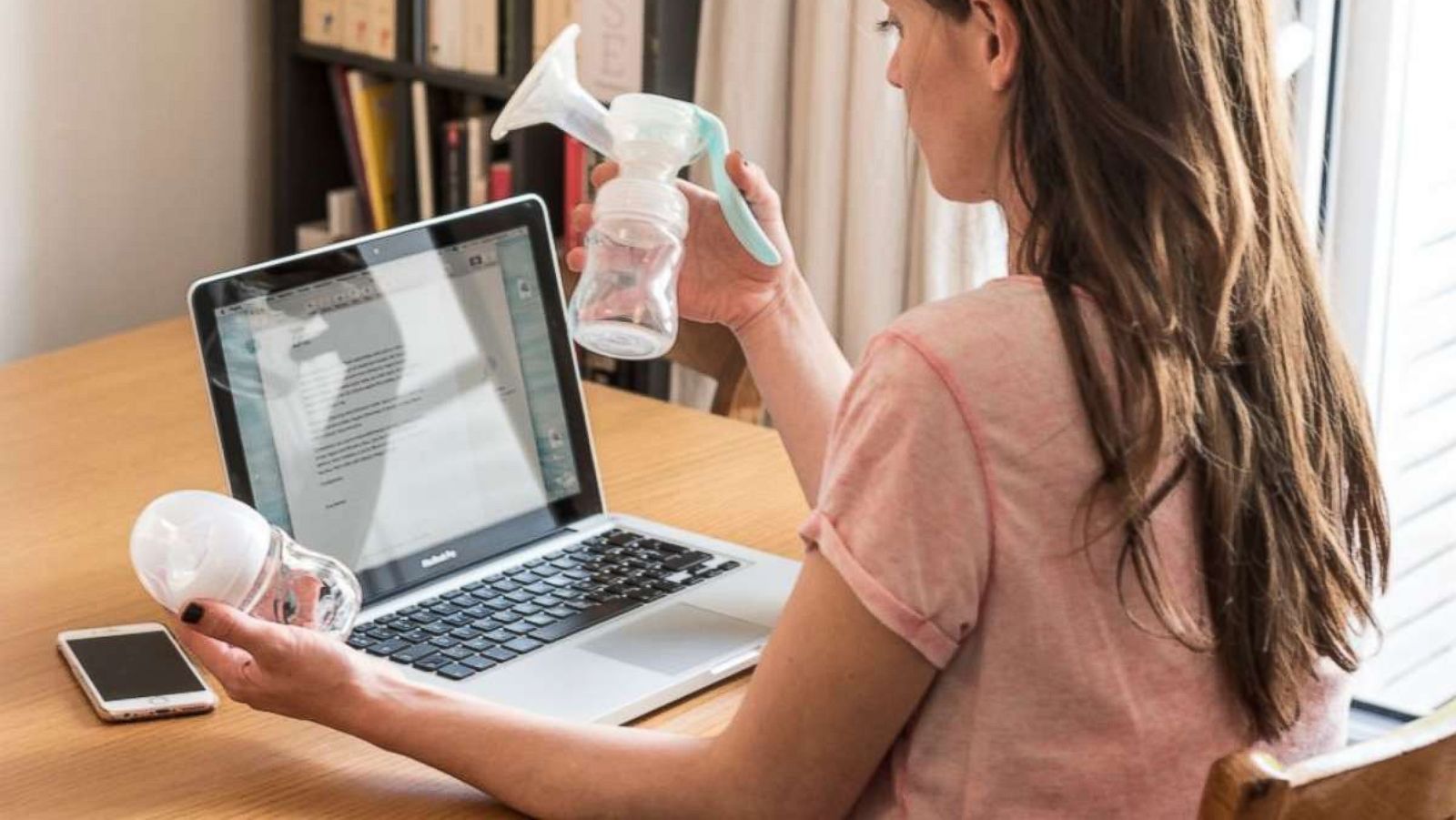 PHOTO: A working mother holding a breast pump is seen in this undated stock photo.