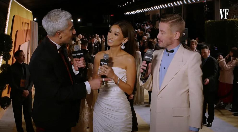 PHOTO: Brenda Song and Macaulay Culkin speak with Tan France at the Vanity Fair Oscar Party Livestream in Los Angeles, March 2, 2025.