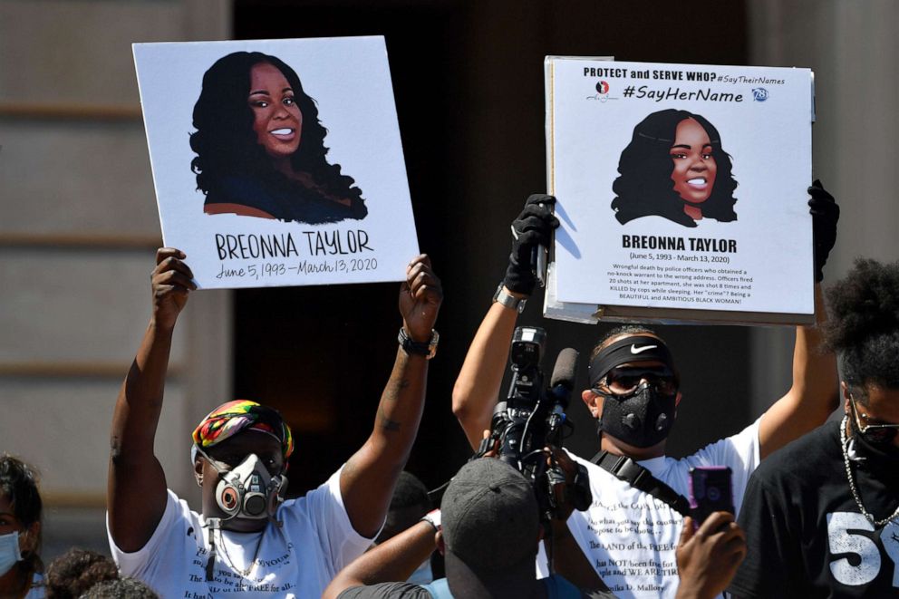 PHOTO: Signs are held up showing Breonna Taylor during a rally in her honor on the steps of the Kentucky State Capitol in Frankfort, Ky., June 25, 2020.