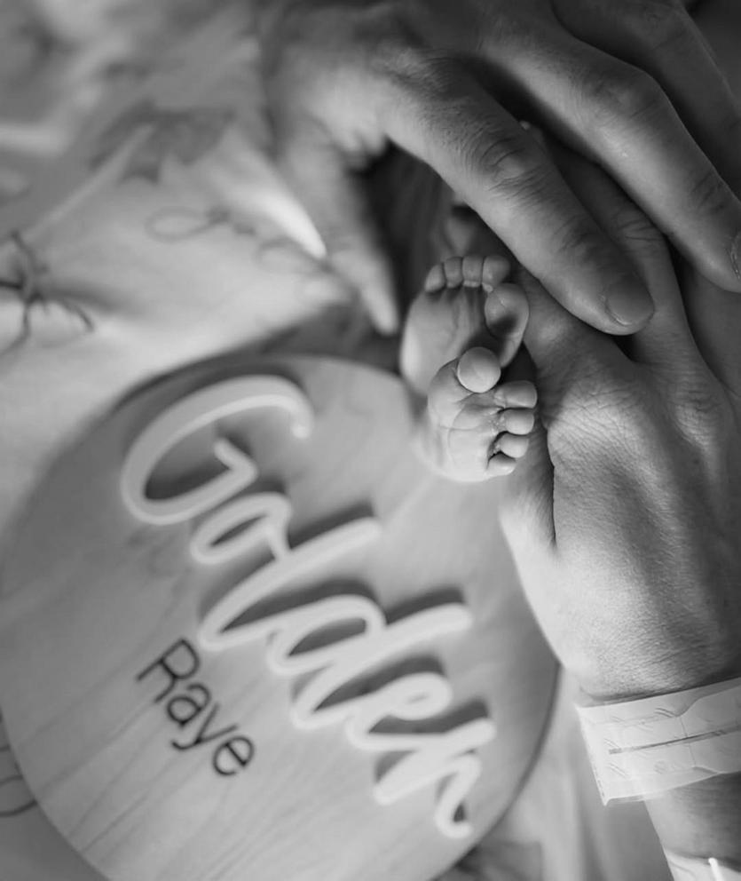 PHOTO: Black and white photo shared by Patrick and Brittany Mahomes shows hands holding a baby's feet.