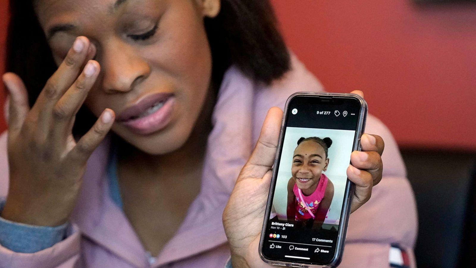 PHOTO: FILE - Brittany Tichenor-Cox holds a photo of her daughter, Isabella "Izzy" Tichenor, during an interview on Nov. 29, 2021, in Draper, Utah.