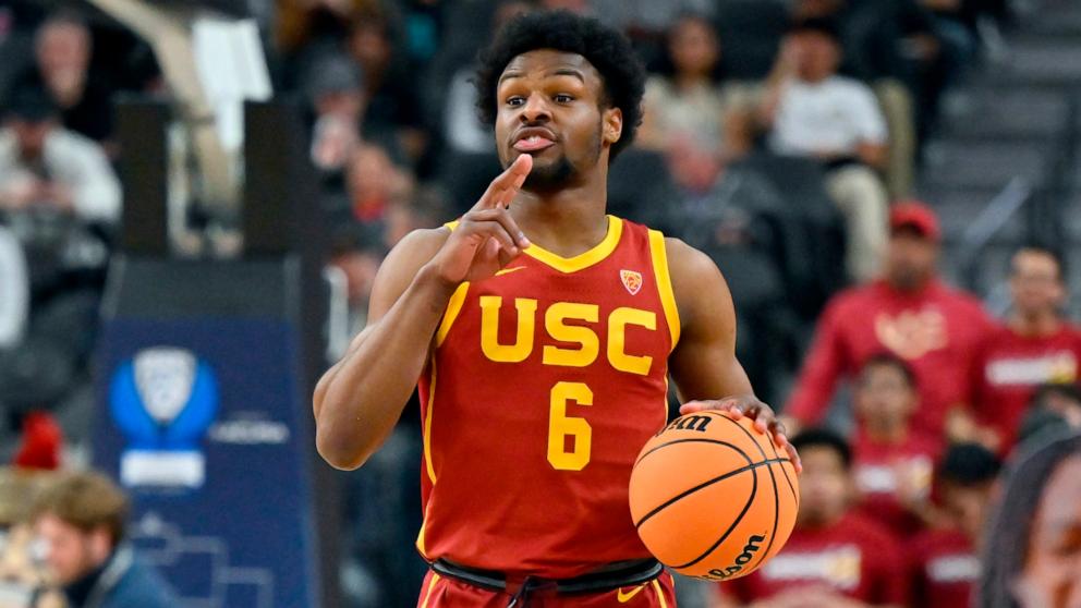 PHOTO: Bronny James of the USC Trojans handles the ball in the first half of a first-round game against the Washington Huskies during the Pac-12 Conference basketball tournament. Mar. 13, 2024, in Las Vegas.