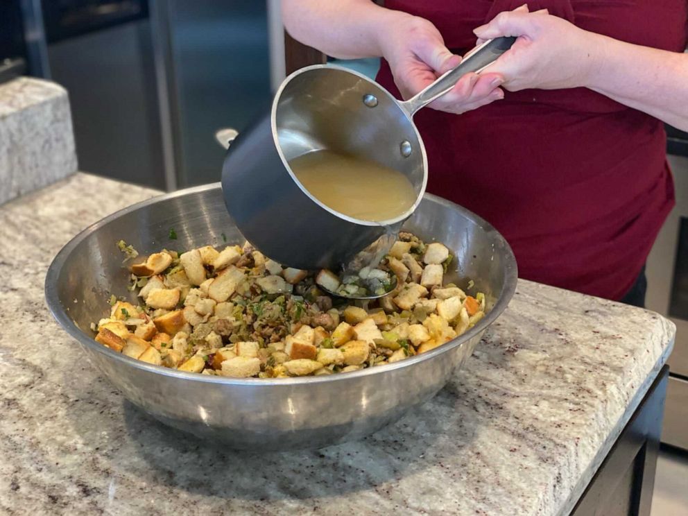 PHOTO: The warm butter and chicken stock get mixed in with the stuffing ingredients.