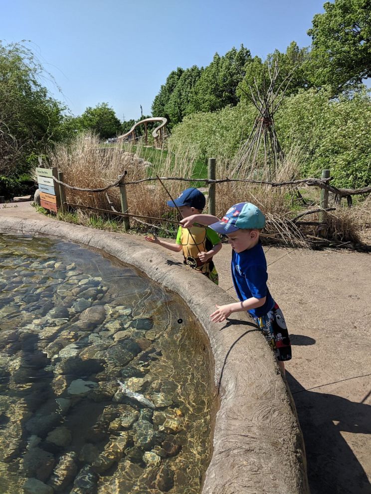 PHOTO: Levi, 4 and Logan Daniels 3, fish in a pond that holds faux fish at a museum in South Dakota. 