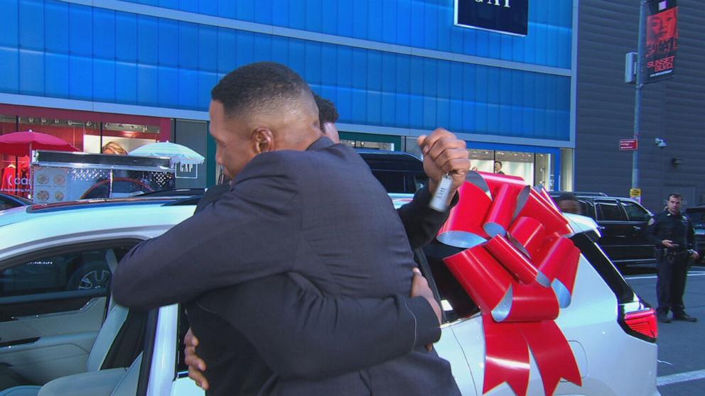 PHOTO: "Good Morning America" co-anchor Michael Strahan and Armorion Smith, 21, shared a hug after Smith and his siblings were surprised with a check, a Disney trip and a new car on Nov. 6, 2024.