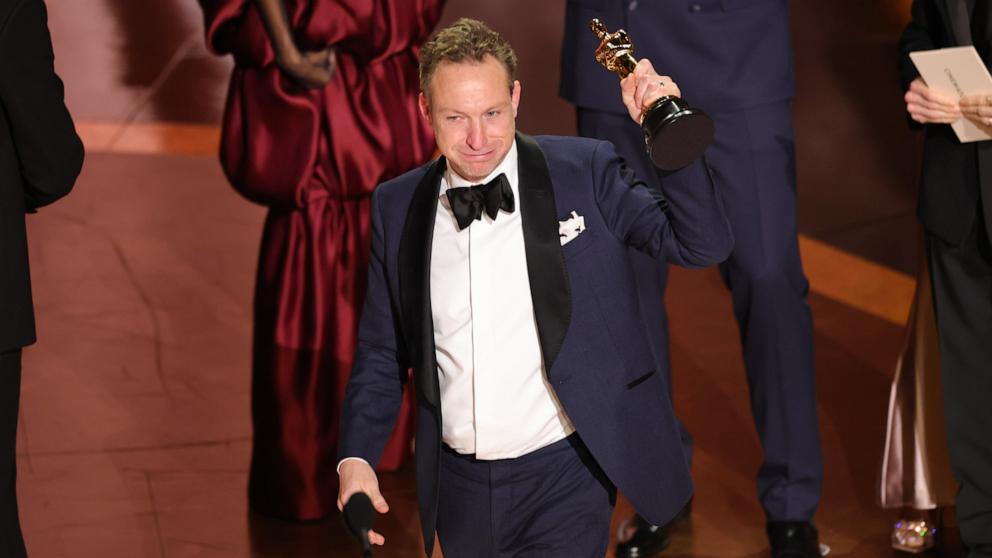 PHOTO: Lol Crawley accepts the Cinematography award for "The Brutalist" onstage during the 97th Annual Oscars March 2, 2025 in Hollywood.