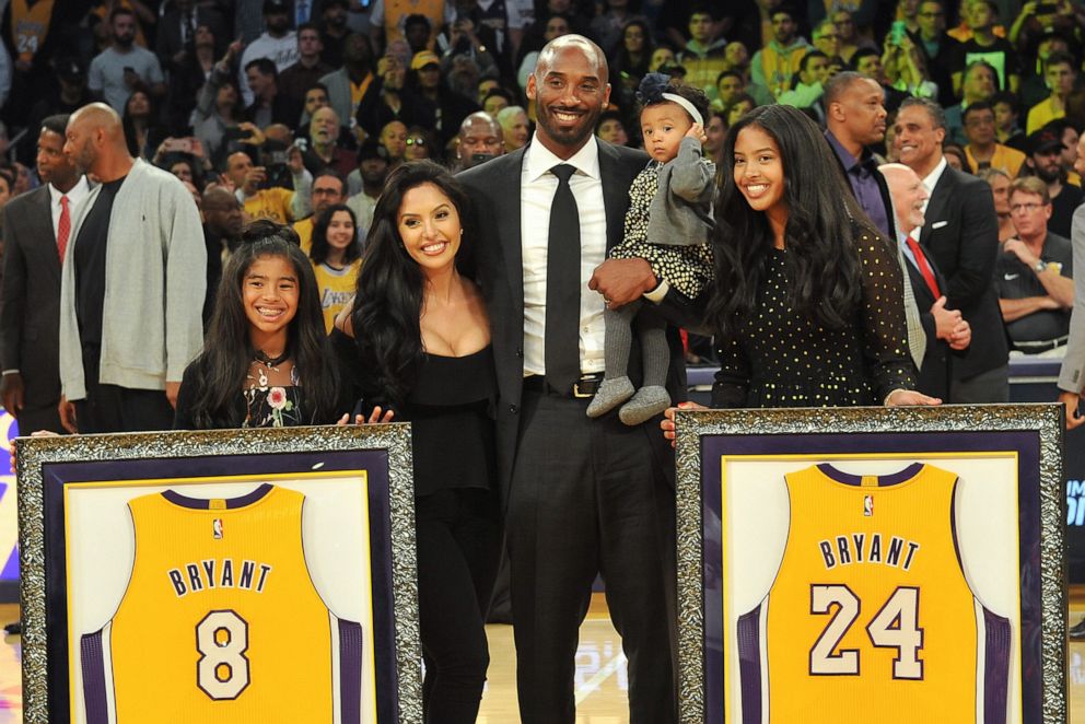 PHOTO: Kobe Bryant, wife Vanessa Bryant and daughters Gianna Maria Onore Bryant, Natalia Diamante Bryant and Bianka Bella Bryant attend Kobe Bryant's jersey retirement ceremony during a game between at Staples Center on Dec. 18, 2017, in Los Angeles.