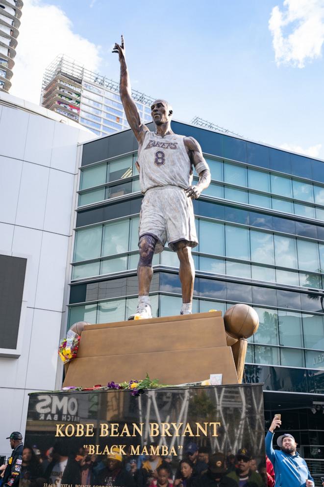 PHOTO: Fans gather outside of the Crypto.com Arena, formerly Staples Center, to celebrate the public unveiling of the new Kobe Bryant statue in honor of the basketball star who died in 2020 on February 09, 2024 in Los Angeles.