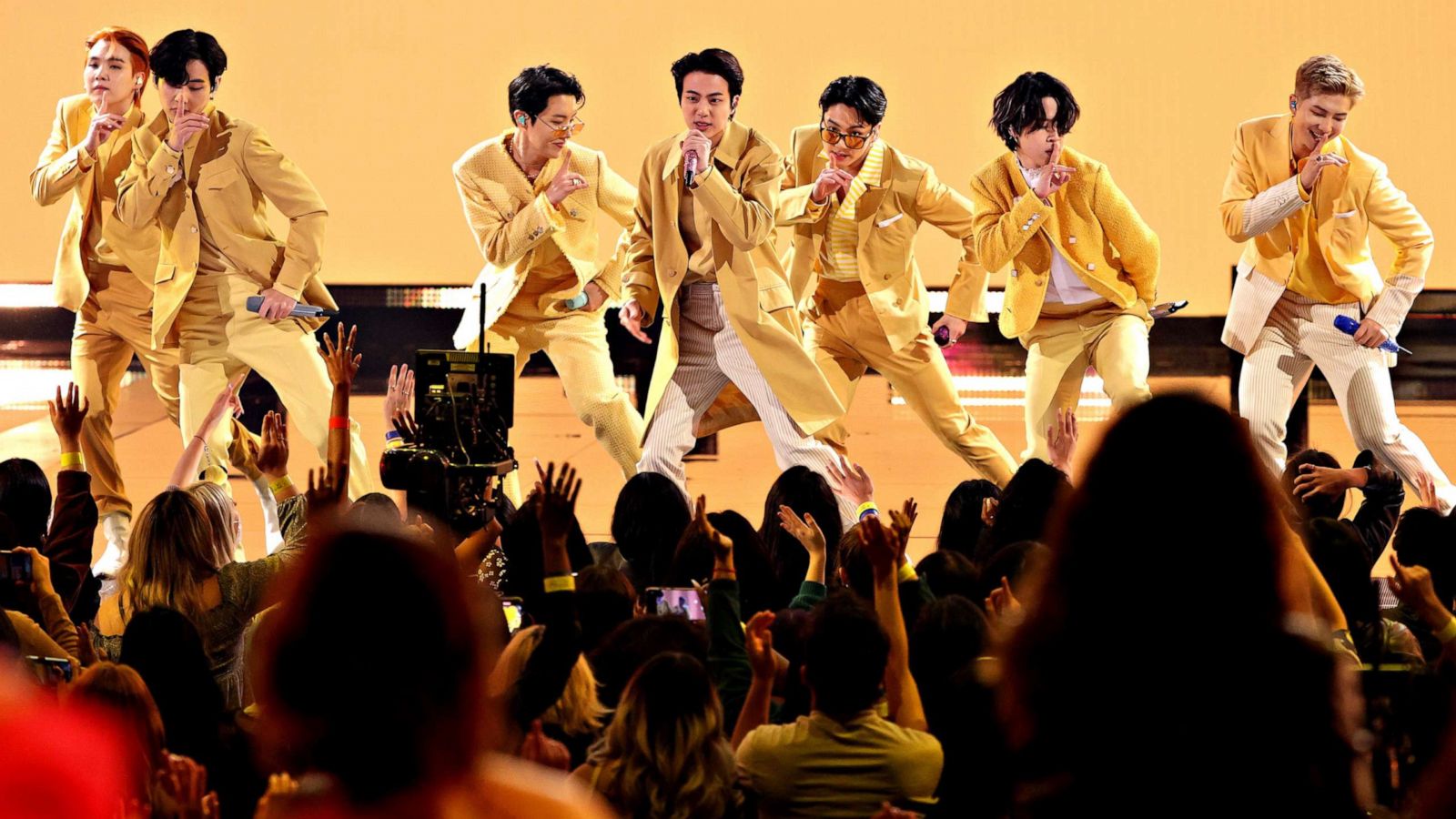 PHOTO: Left to right, Suga, V, J-Hope, Jin, Jungkook, Jimin, and RM of BTS perform onstage during the 2021 American Music Awards at Microsoft Theater on Nov. 21, 2021, in Los Angeles, Calif.