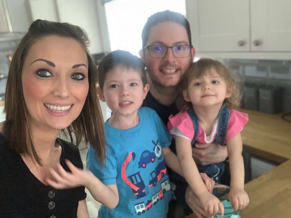 PHOTO: Katie Eborall poses with her husband and two children in Leeds, England.