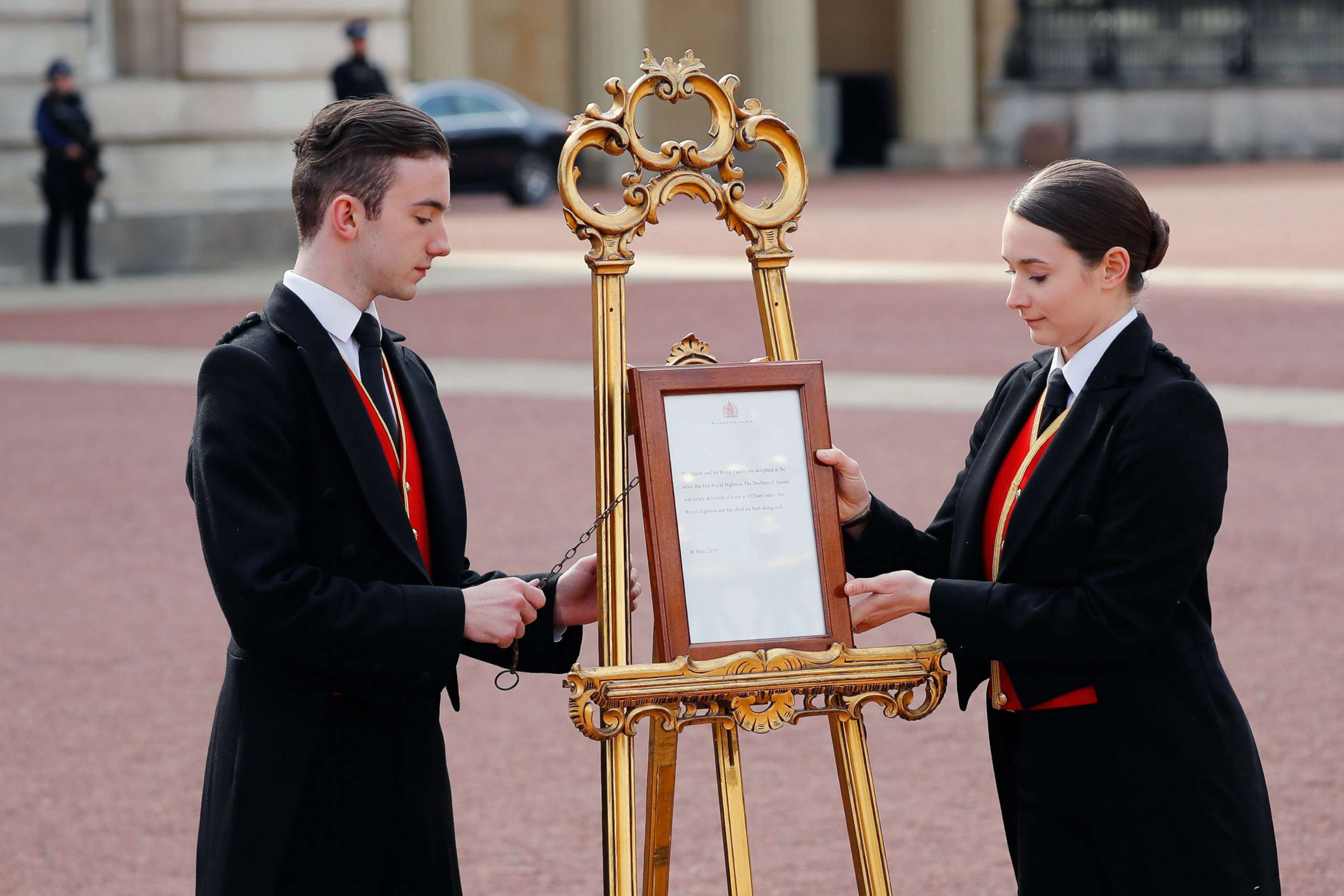 PHOTO: Members of staff set up an official notice on an easel at the gates of Buckingham Palace in London on May 6, 2019 announcing the birth of a son to Britain's Prince Harry, Duke of Sussex and Meghan, Duchess of Sussex.