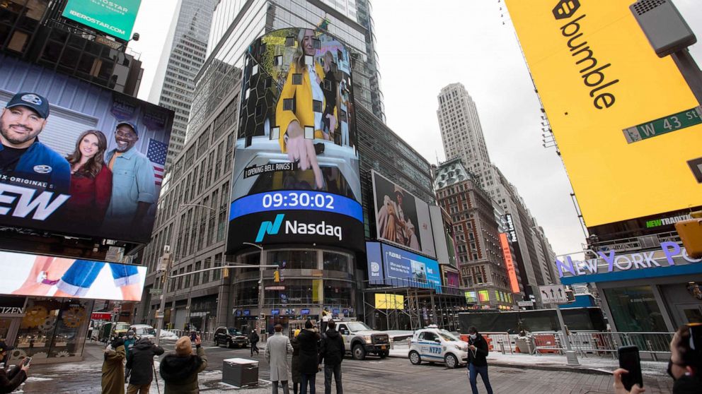 PHOTO: A monitor displays Whitney Wolfe Herd, chief executive officer of Bumble Inc., ringing the opening bell during Bumble Inc.'s initial public offering (IPO) in front of the Nasdaq Market Site in New York, Feb. 11, 2021. 