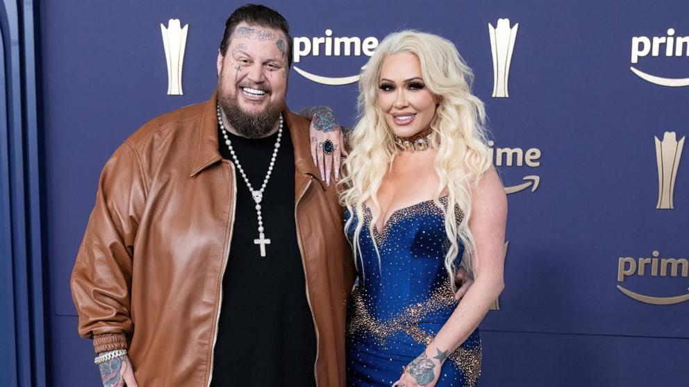 PHOTO: US singer Jelly Roll (L) and Bunnie Xo arrive for the 59th Academy of Country Music awards (ACM) at Ford Center in The Star in Frisco, Texas, May 16, 2024. 