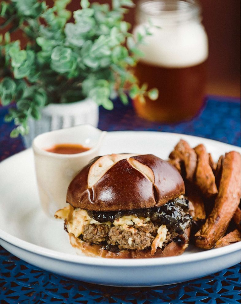 PHOTO: Kenny Gilbert's signature smokehouse burger on a pretzel bun.
