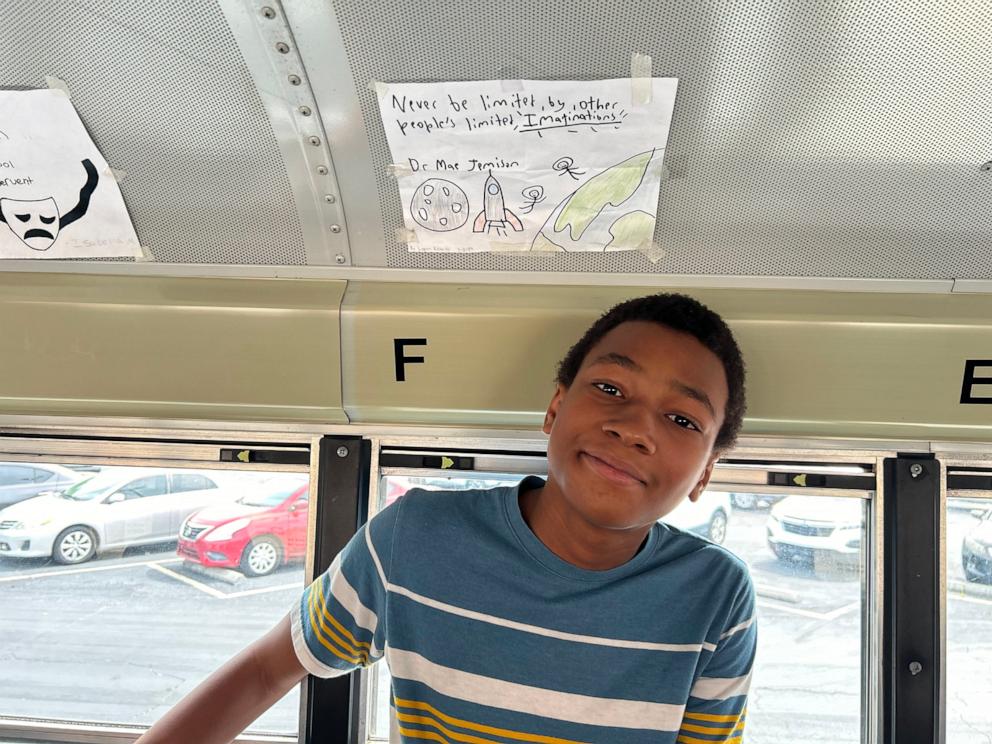 PHOTO: The handwritten messages on Anthony Burgess’ school bus feature students’ favorite quotes.