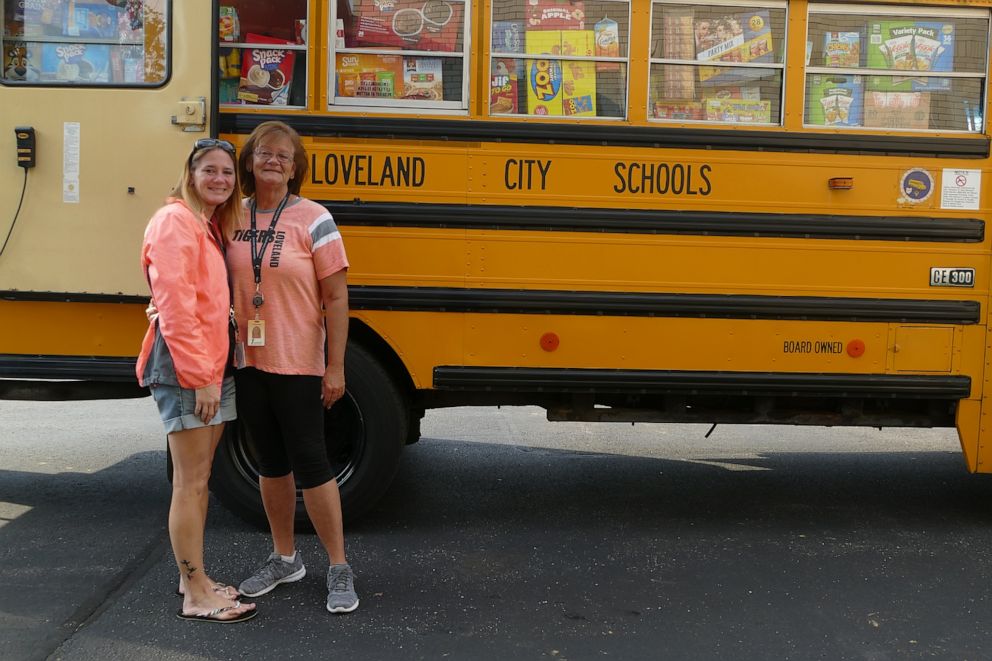 PHOTO: Lisa Moorhead, a driver of 23 years and Loveland School district''s courier, poses with her daughter, Michele Winter, who is also a school bus driver for Loveland City Schools in Loveland, Ohio.