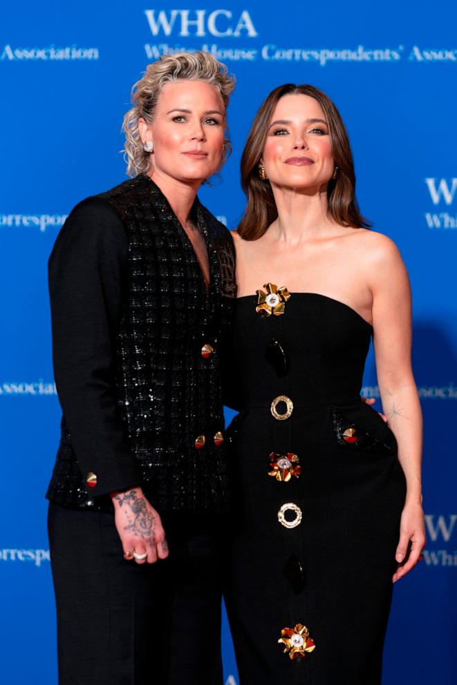 PHOTO: Former football player Ashlyn Harris, left, and actress Sophia Bush, poses for photographers as she arrives at the annual White House Correspondents' Association Dinner in Washington, April 27, 2024.