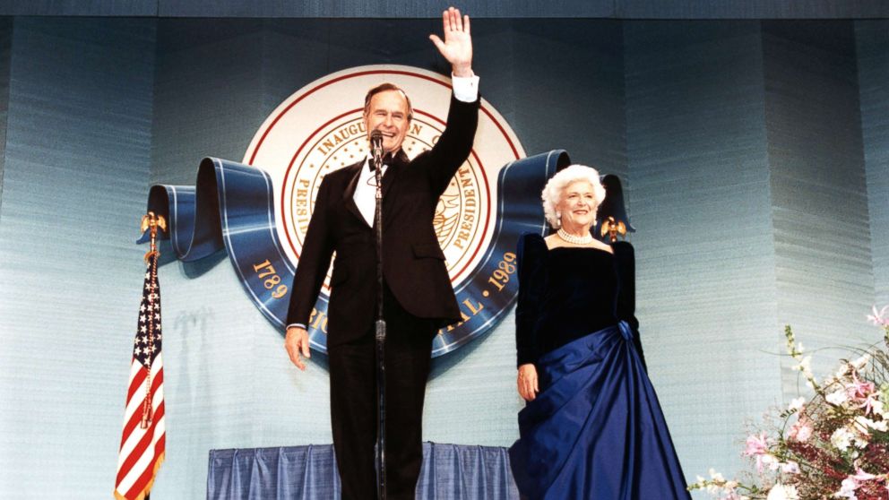 PHOTO: George Bush smiles and waves to participants of his inaugural celebration with his wife Barbara in Washington D.C., Jan. 20, 1989.