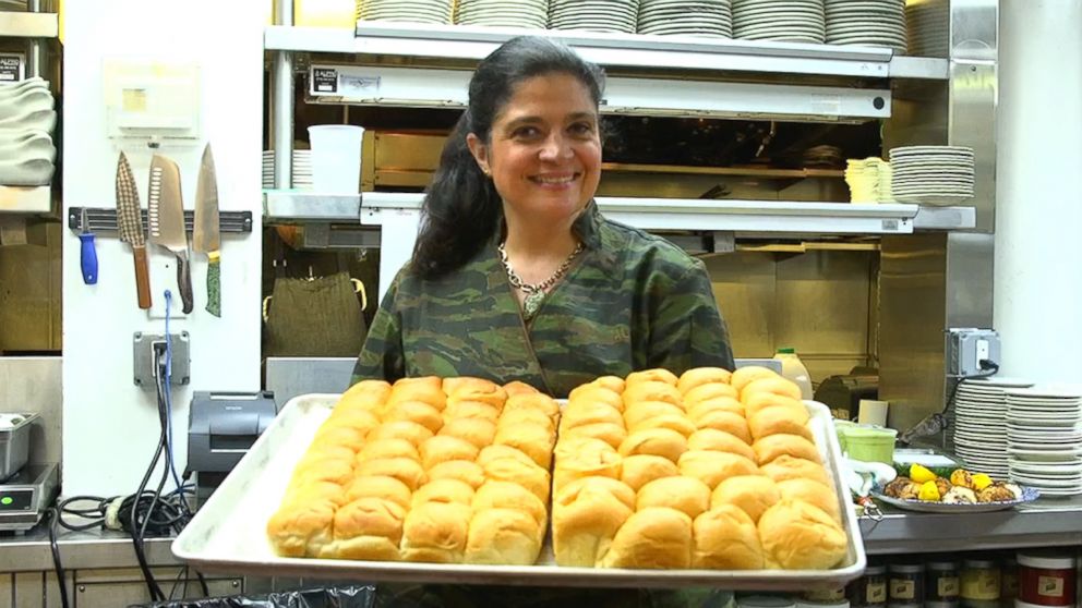 PHOTO: Executive chef and owner Alex Guarnaschelli of Butter in New York City holds up a tray of Parker House rolls.
