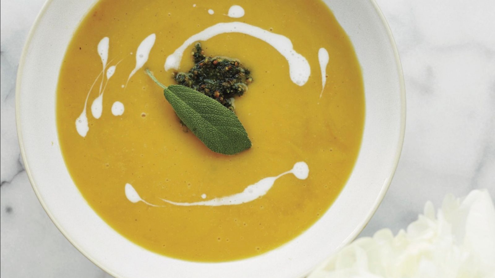 PHOTO: A bowl of butternut squash soup with sage pesto.