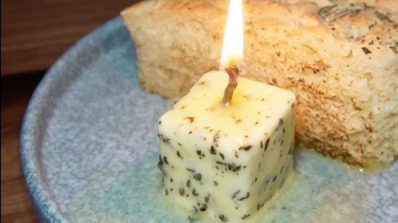 PHOTO: A herb compound butter candle served with fresh focaccia bread.