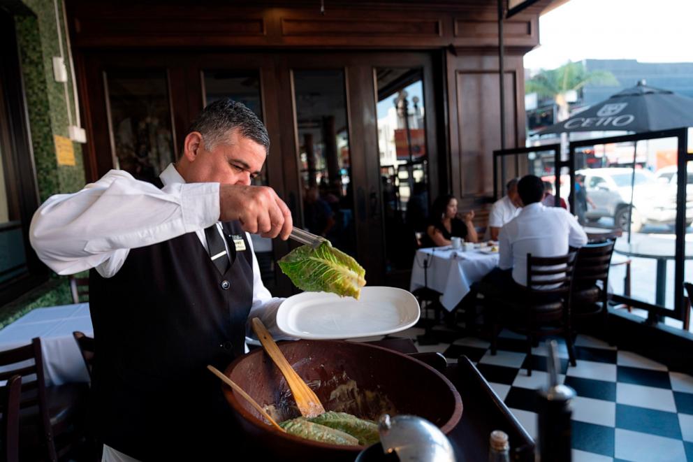 PHOTO: Salad Master Efrain Montoya prepares a Caesar salad at Ceasar's restaurant, June 27, 2024, in Tijuana, Mexico. 