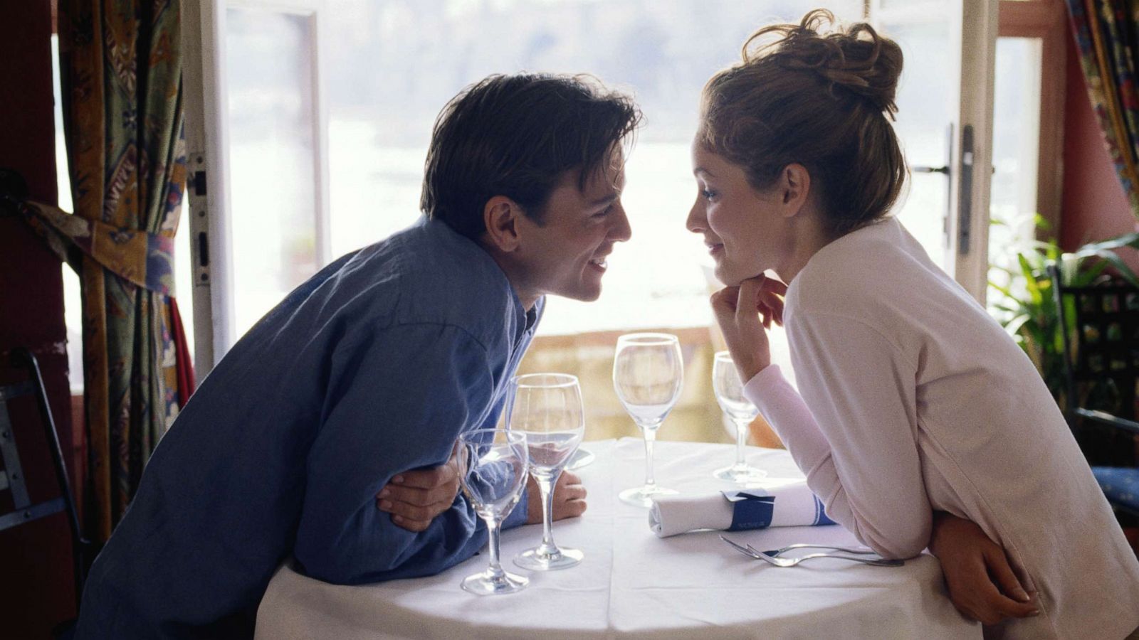 PHOTO: A couple talk at a cafe.