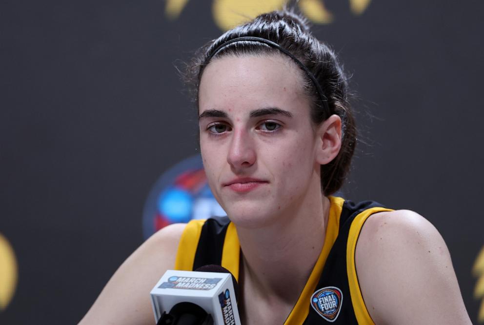 PHOTO: Caitlin Clark #22 of the Iowa Hawkeyes speaks with the media after losing to the S.C. Gamecocks in the 2024 NCAA Women's Basketball Tournament National Championship at Rocket Mortgage FieldHouse April 07, 2024 in Cleveland, Ohio.
