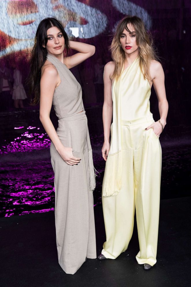PHOTO: (L-R) Camila Morrone and Suki Waterhouse attend the Boss Spring/Summer 2023 Miami Runway Show at One Herald Plaza on March 15, 2023 in Miami.