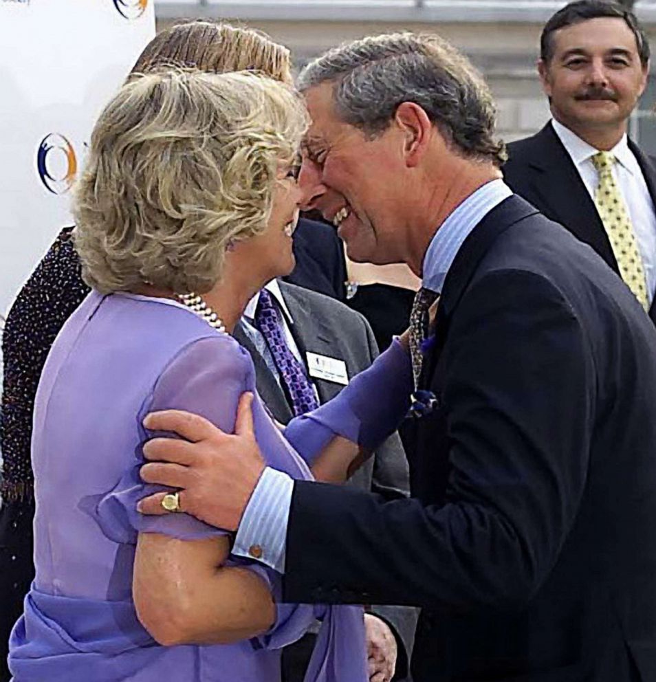 PHOTO: Camilla Parker-Bowles, in her official role as patron of the National Osteoporosis Society, welcomes Prince Charles with a kiss to the anniversary event at Somerset House in London, June 26, 2001.