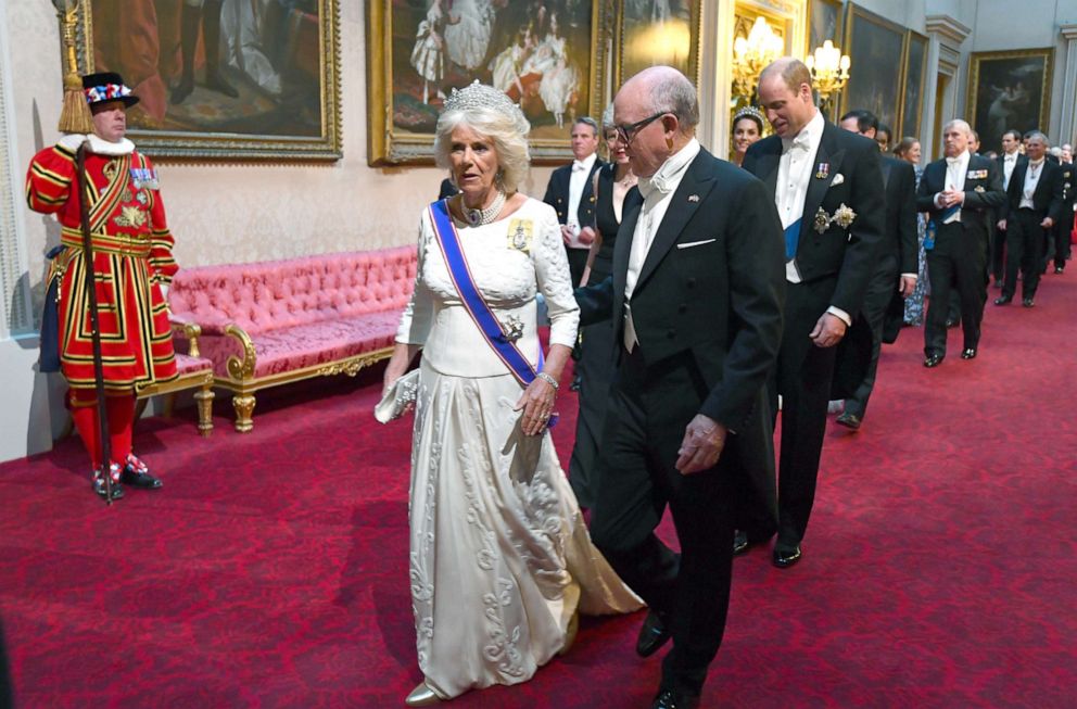 PHOTO: Camilla, Duchess of Cornwall and Robert Wood Johnson, the United States Ambassador to the United Kingdom arrive through the East Gallery for a State Banquet at Buckingham Palace, June 3, 2019, in London.