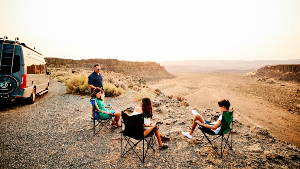 PHOTO: Stock photo of a group of people camping. 