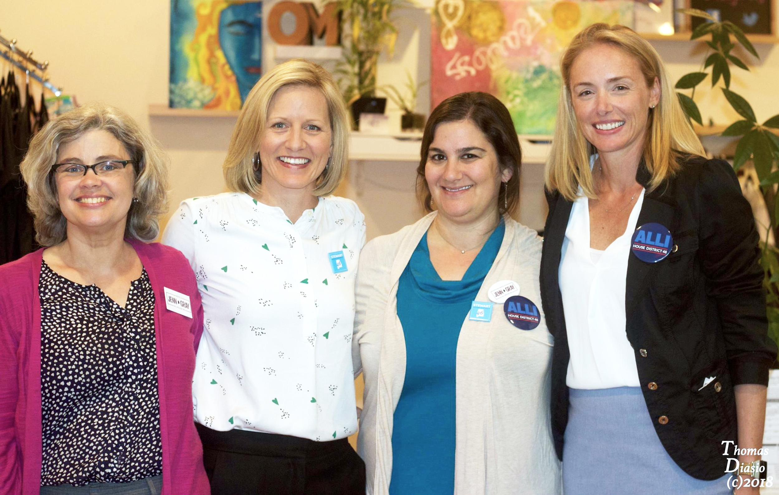 PHOTO: Jenn Gray, far left, Felicia Stewart, second from left, and Alli Summerford, far right, pose with a supporter at a campaign event.