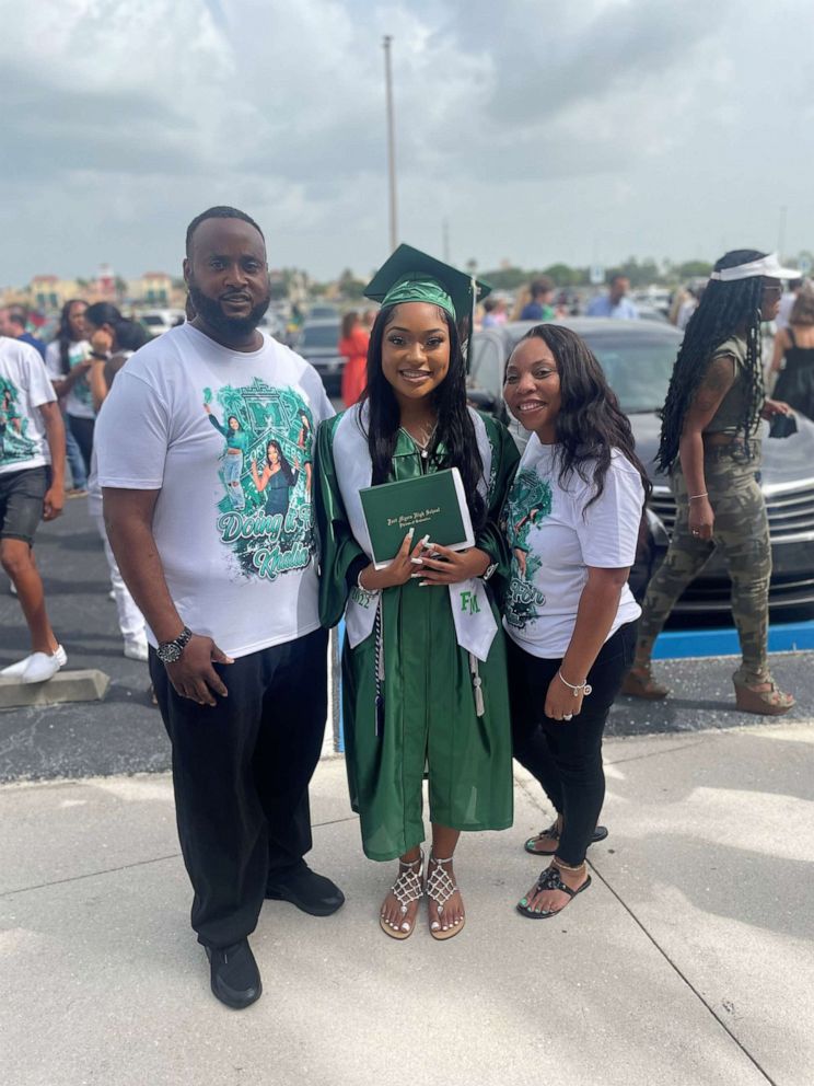 PHOTO: Khalia Carter poses with her parents, Reginald and Shawnda Cook at her graduation from Fort Myers High School, which was held at Hertz Arena in Fort Myers, Fla., May 21, 2022.
