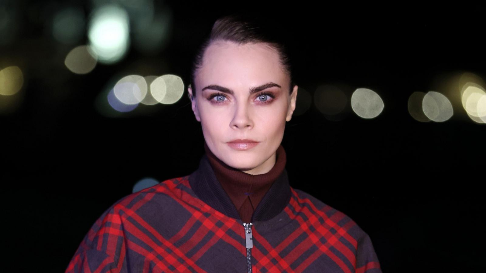 PHOTO: Cara Delevingne attends the Burberry show during London Fashion Week February 2024 at Victoria Park on Feb. 19, 2024 in London.