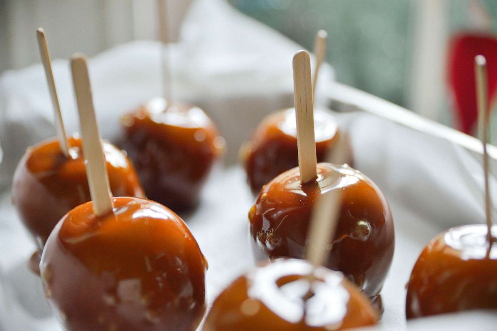 PHOTO: Caramel apples cool on wax paper.
