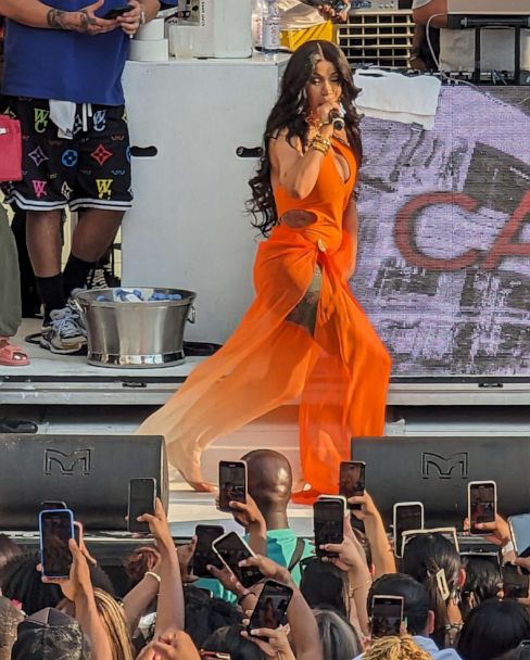 Cardi B throws mic after fan tosses drink at star during performance