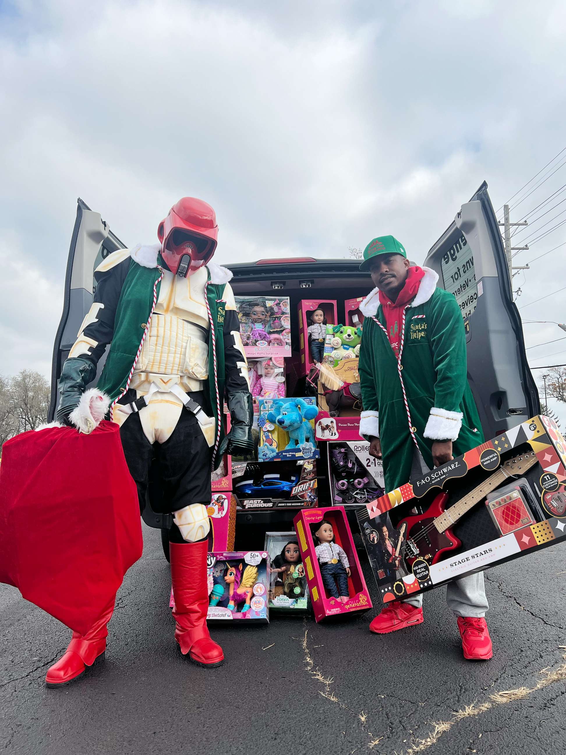 PHOTO: Yuri Williams and Rodney Smith Jr. have been dressing up as a superhero and an elf to surprise people and animals in need with gifts, donations and much-needed support.