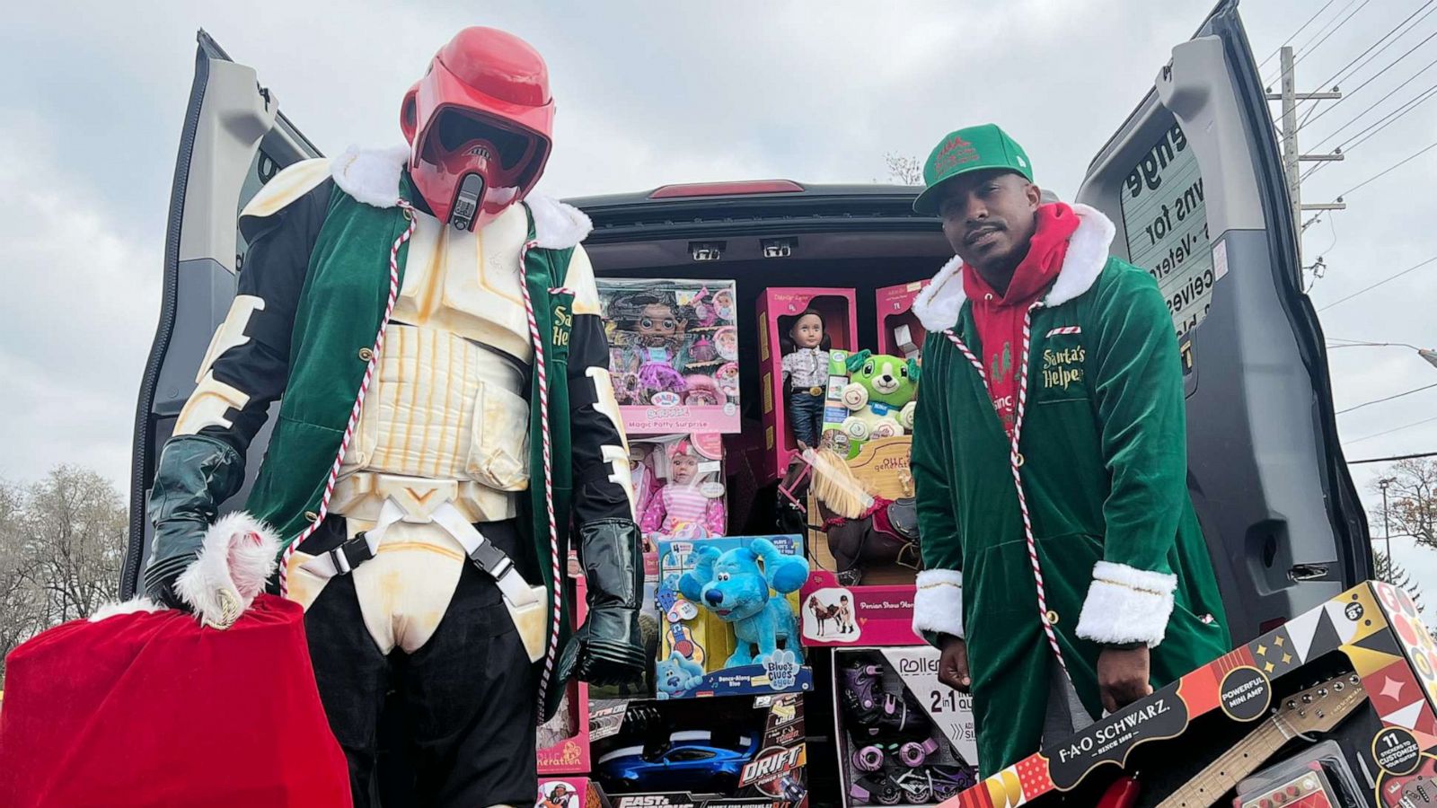 PHOTO: Yuri Williams and Rodney Smith Jr. have been dressing up as a superhero and an elf to surprise people and animals in need with gifts, donations and much-needed support.