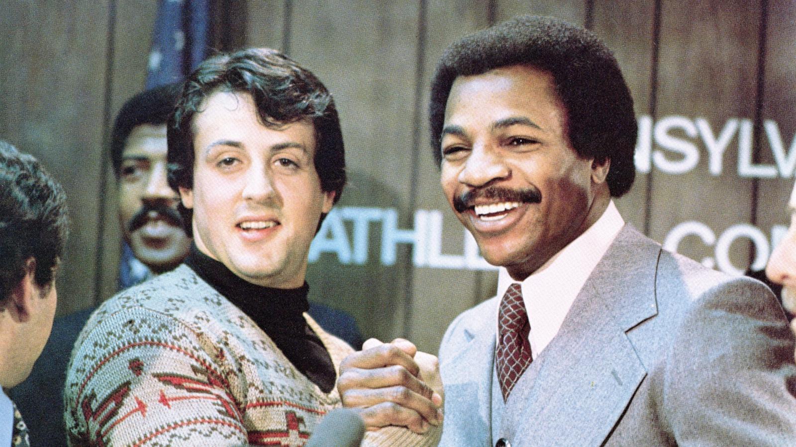 PHOTO: Sylvester Stallone and Carl Weathers grip hands in a still from the film, 'Rocky,' in 1976.