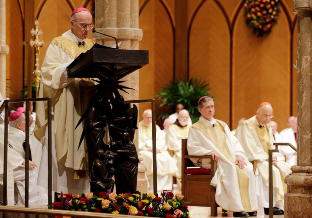 In this Nov. 18, 2014 file photo, Archbishop Carlo Maria Vigano reads the Apostolic Mandate during the Installation Mass of Archbishop Blase Cupich at Holy Name Cathedral, in Chicago. 