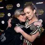 Actresses Carrie Fisher (L) and Billie Lourd embrace as they arrive at the premiere of &quot;Star Wars: The Force Awakens&quot; in Hollywood, Calif., December 14, 2015.