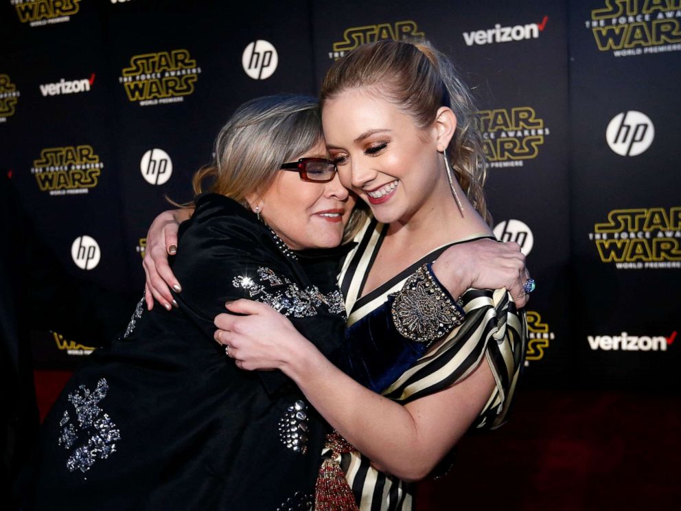 PHOTO: Actresses Carrie Fisher (L) and Billie Lourd embrace as they arrive at the premiere of Star Wars: The Force Awakens in Hollywood, Calif., December 14, 2015.