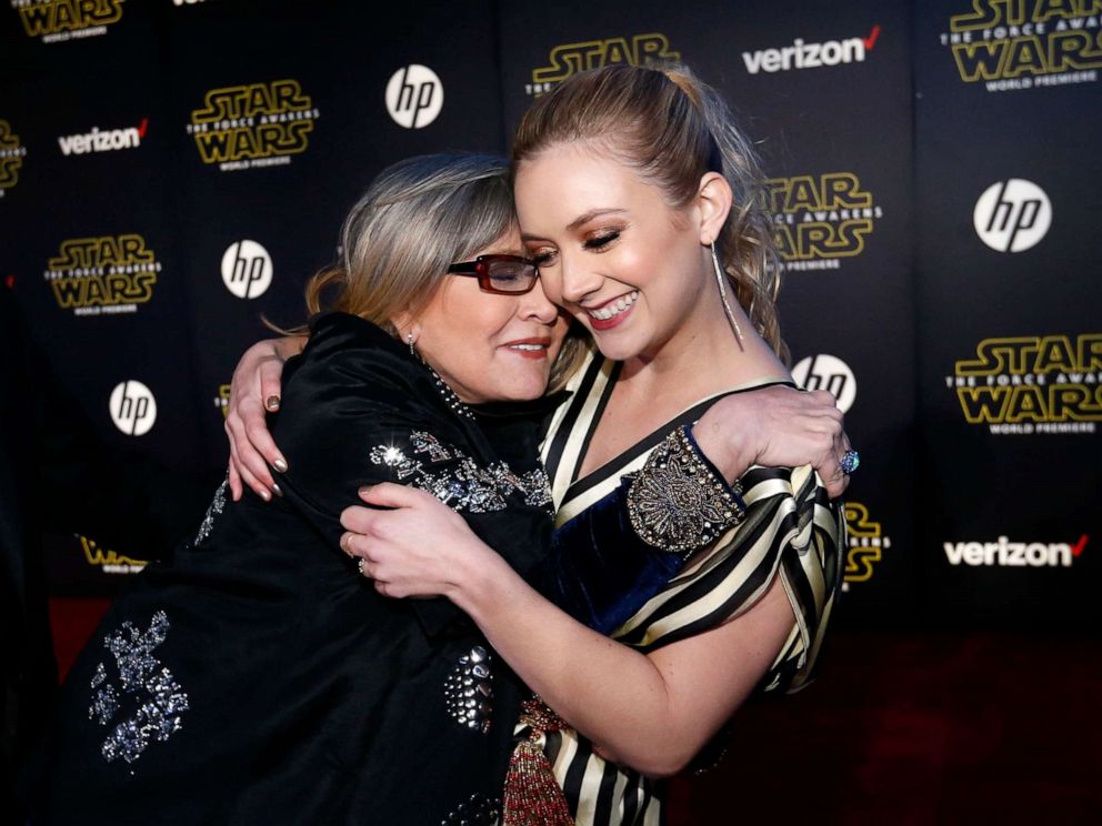 PHOTO: Actresses Carrie Fisher (L) and Billie Lourd embrace as they arrive at the premiere of "Star Wars: The Force Awakens" in Hollywood, Calif., December 14, 2015.
