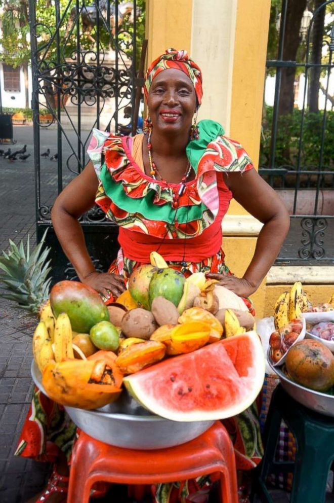 PHOTO: A local fruit vendor poses on the streets of Cartagena's Old City.