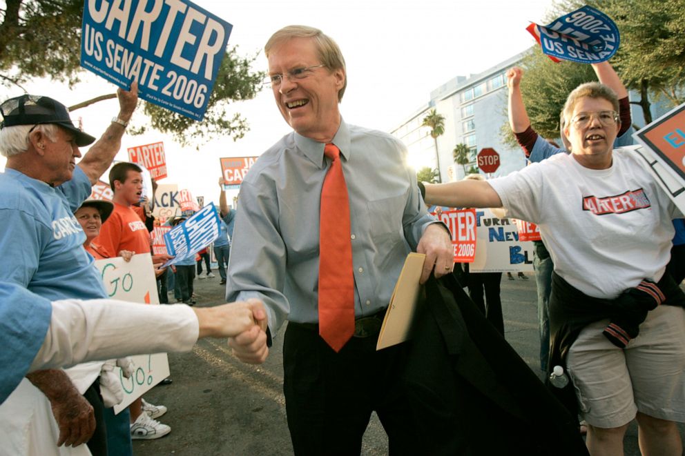 PHOTO: U.S. Senate candidate Jack Carter is greeted by supporters as he walks into the Channel 8 studios in Las Vegas for a debate with incumbent U.S. Sen. John Ensign, Oct. 15, 2006.