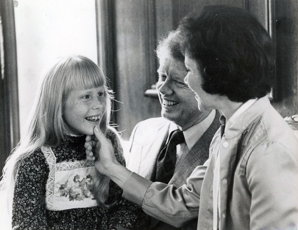 PHOTO: Amy Carter with her father Jimmy and mother Rosalynn Carter in a family suite at the Americana Hotel in Washington, D.C., July 14, 1976.
