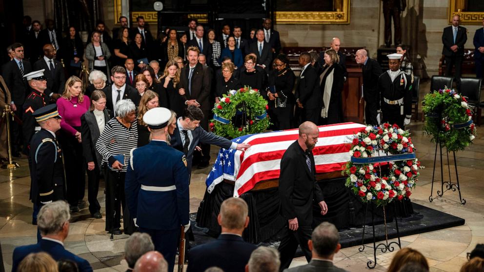 PHOTO: The Carter family pay their respects during a ceremony as the flag-draped casket of former President Jimmy Carter lies in state, at the Capitol in Washington, DC, Jan. 7, 2025.