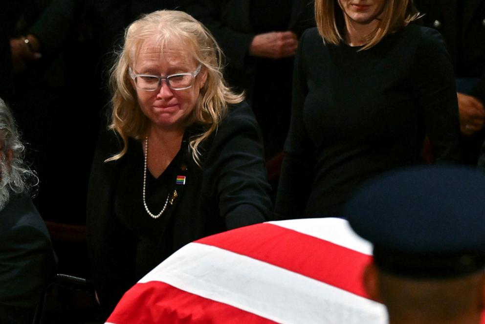 PHOTO: Amy Carter touches the flag-draped casket of her father, former President Jimmy Carter, after a ceremony where Carter lies in state at the Capitol in Washington, DC, Jan. 7, 2025. 